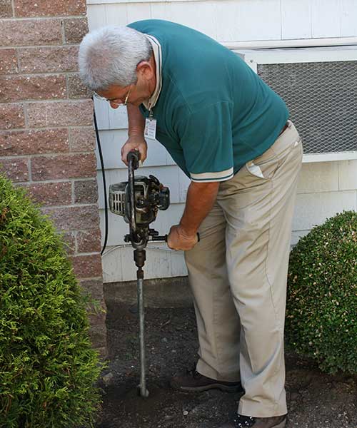 man drilling ground